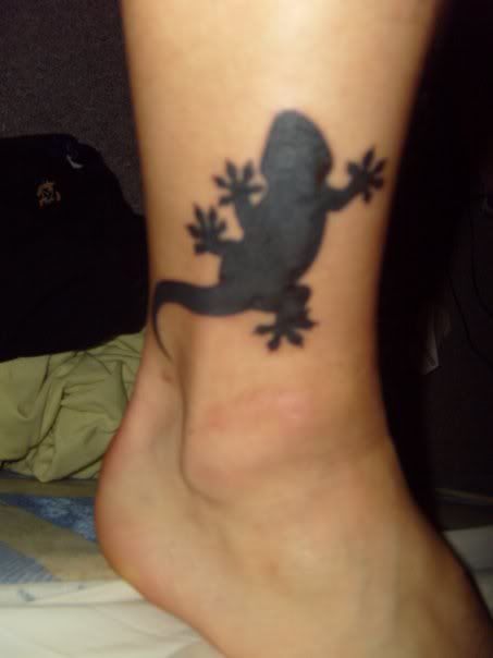 Simple black reptile tattoo design