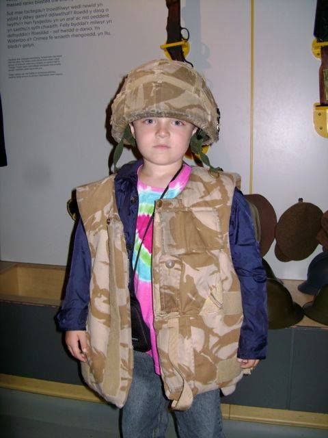 Rhys playing dress up in The Firing Line, a museum of the Welsh soldier. photo 10533995_10154435958445023_5474827371576173861_n.jpg