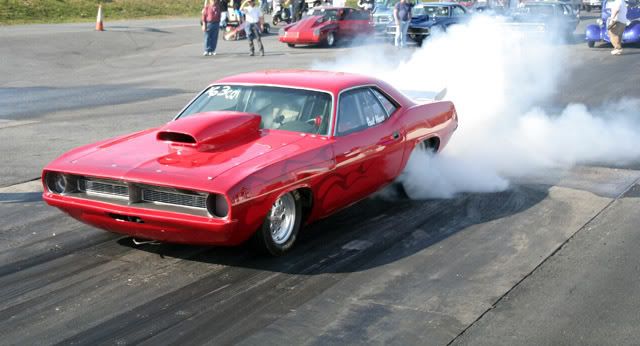 IMAGE: http://img.photobucket.com/albums/v244/ChrisACR/Cars/cudaburnout.jpg