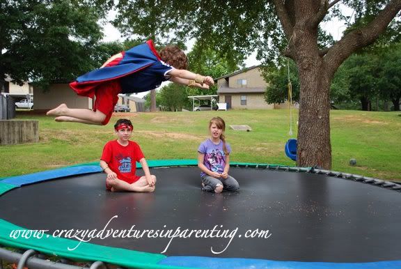 flying super hero on trampoline