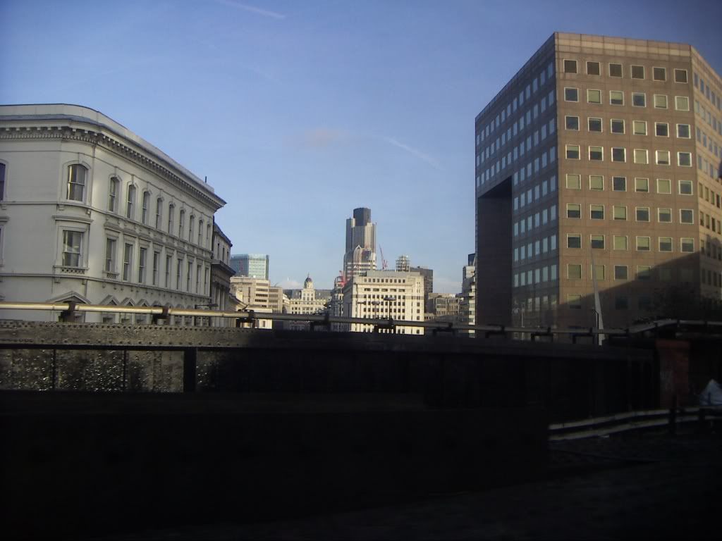 used to be called the Natwest building, and its shaped like the Natwest logo. Natwest is a bank by the way