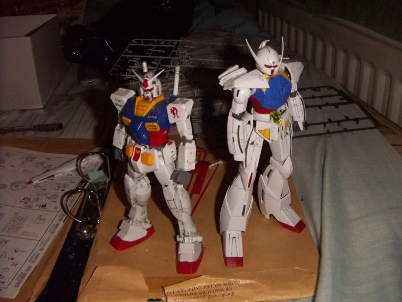 on the left, the first ever Gundam. on the right, the Turn A Gundam, first shown around 2000. i wonder what the first Gundam is thinking when it see's its decendants...