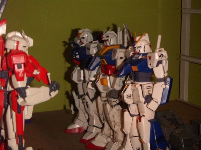 My Gundam Line up. ^^ the space on the shelf behind them is reserved for my 1/100 Wing Models. I usually have a bunch on the shelf, and a bunch in the room, and swap em about
