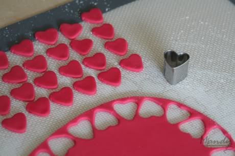 Cutting out fondant hearts