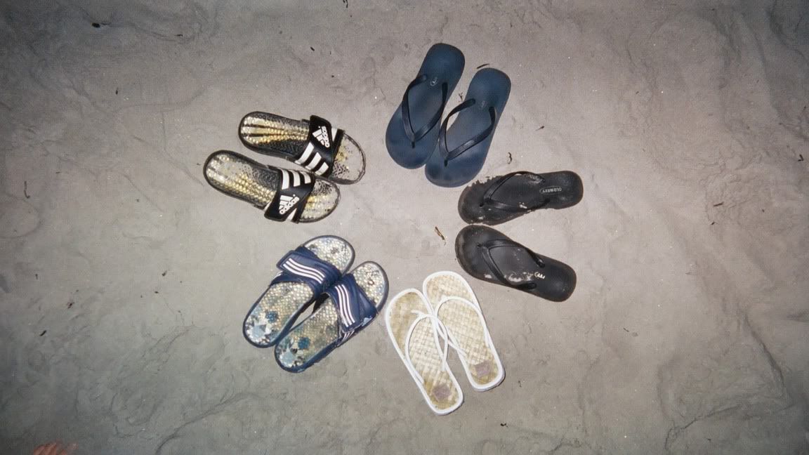 024_24.jpg Our sandles on the beach at night <img class=