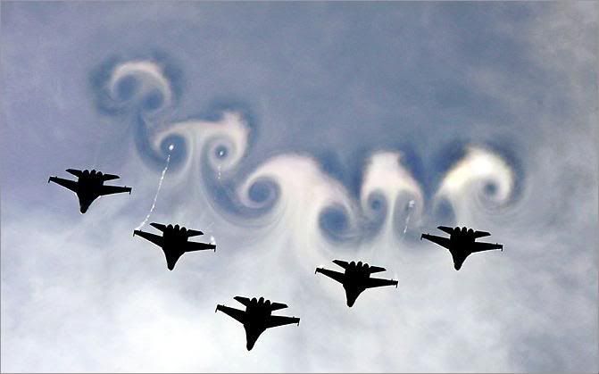 A Russian air force demonstration team paints patterns in the sky with its MiG-29 fighters July 30 during an air show in Monino, Russia, about 40 kilometers from Moscow. The show commemorated the 60th anniversary of victory in World War II.