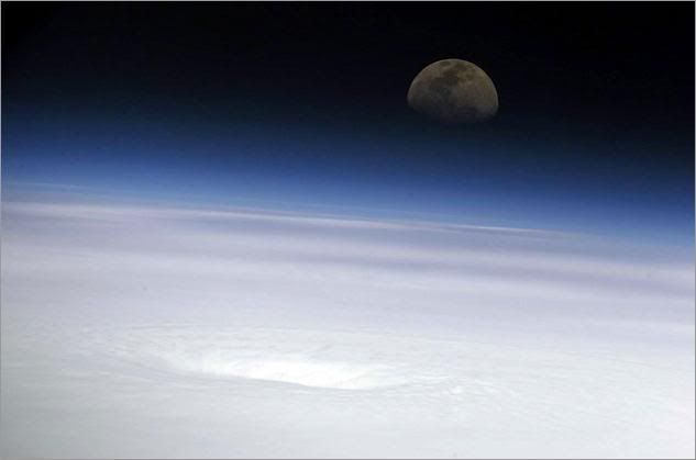 NASA science officer John Phillips took this shot of the moon above the eye of Hurricane Emily from the International Space Station on July 17 as the storm churned in the Caribbean Sea east of Mexico's Yucatan Peninsula