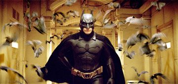 Christian Bale as Batman with bats flying out of his butt