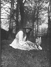The second of the five photographs, showing Elsie with a winged gnome