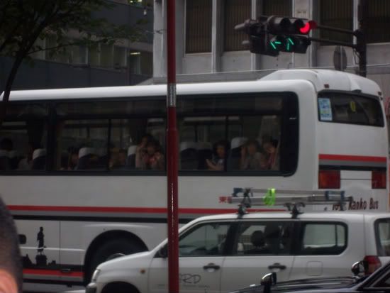 Happy kids waving to the gaijin