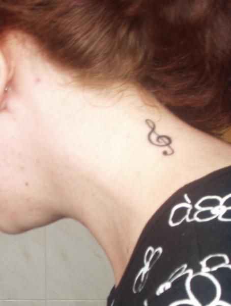 my first tattoo has a music note inside a crescent moon