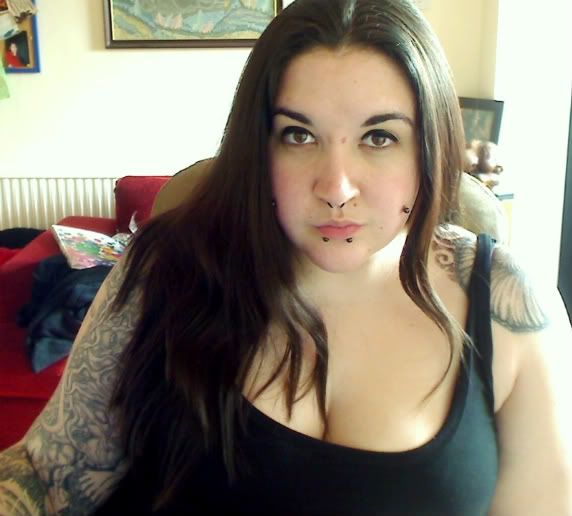  bridge piercing, and I look a bit off because I've been at work all day.