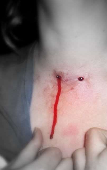 A friend getting a neck piercing. Just messing about with some different 