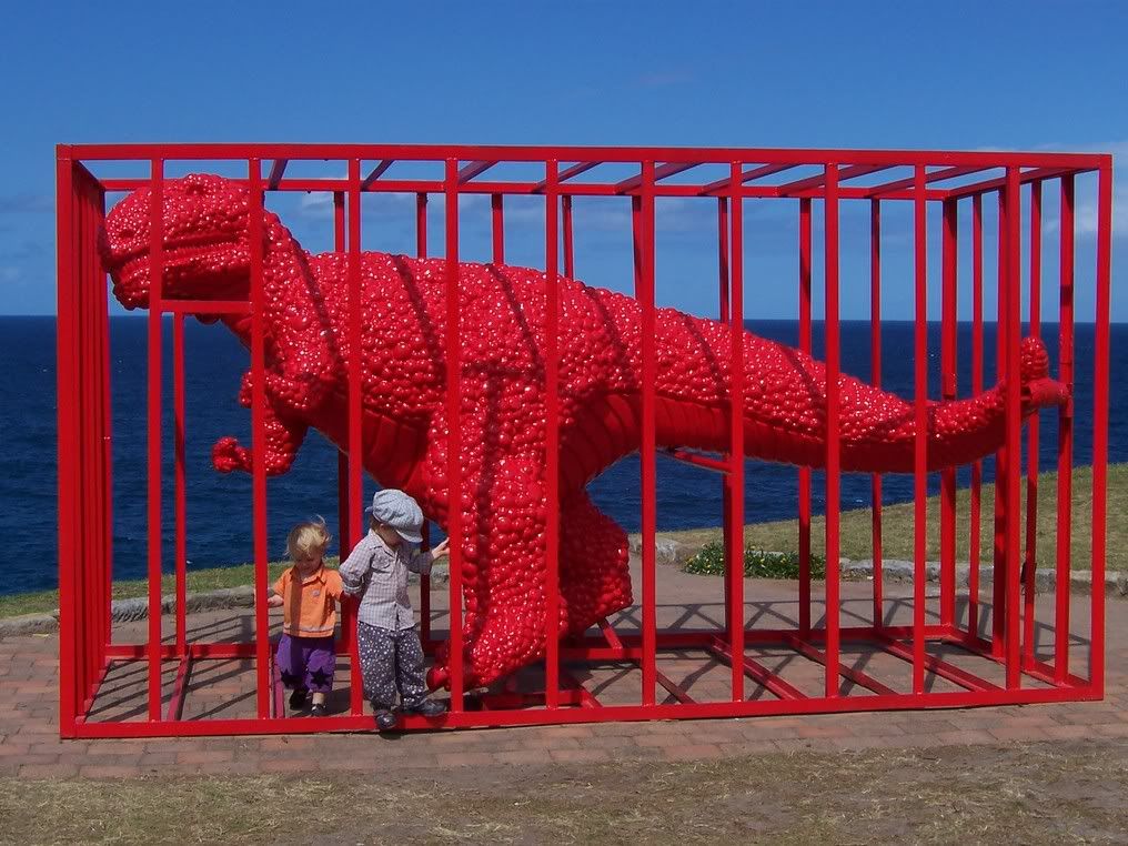 100_06981.jpg Just your typical red plastic T-Rex in a cage. Children in funny clothes not included image by squaylor