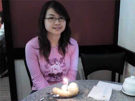 Me with Aunty's Banana Split Ice-cream with candle