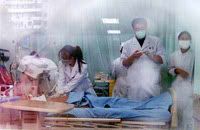 Doctors conduct emergency treatment on a competitor of Beijing International Marathon, October 17, 2004.