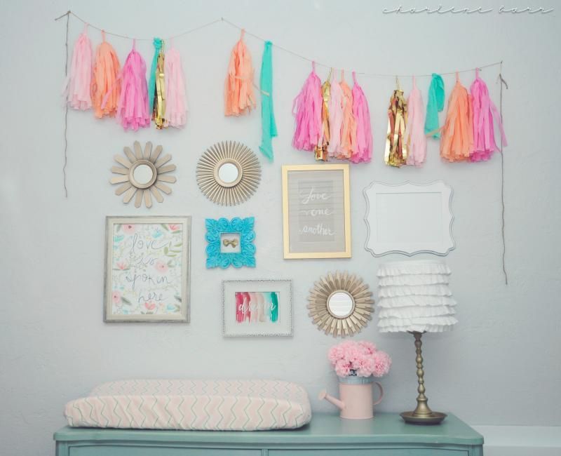 coral, teal/turquoise, and gold nursery decor; tissue paper garland banner in nursery