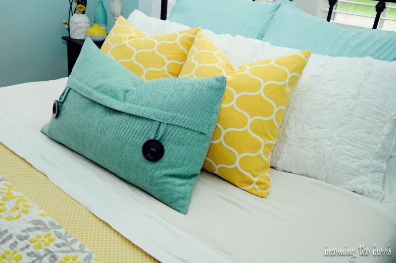 master bedroom decor pillows yellow and aqua