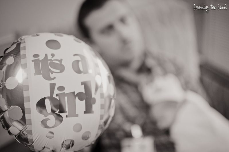 newborn sleeping on daddy its a girl balloon