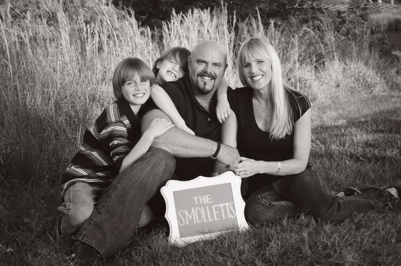 family photoshoot with last name chalkboard