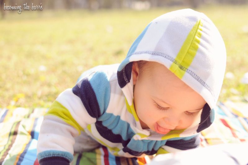 baby boy on blanket in the park for a picnic