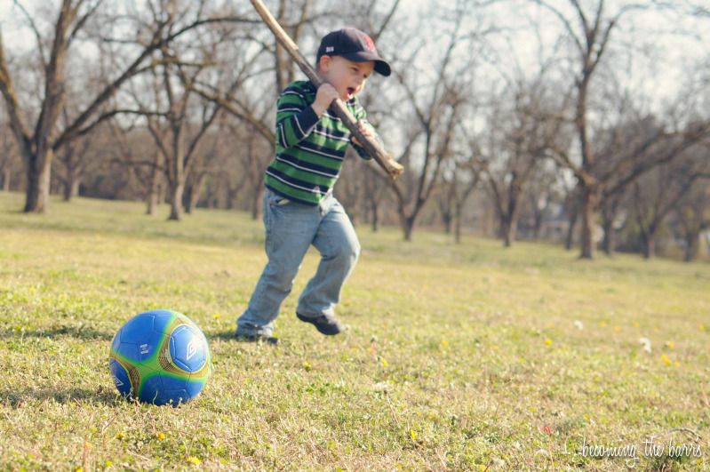 boy playing soccer in the park photography