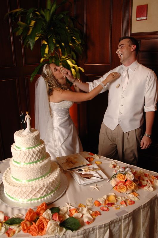 smashing wedding cake in faces