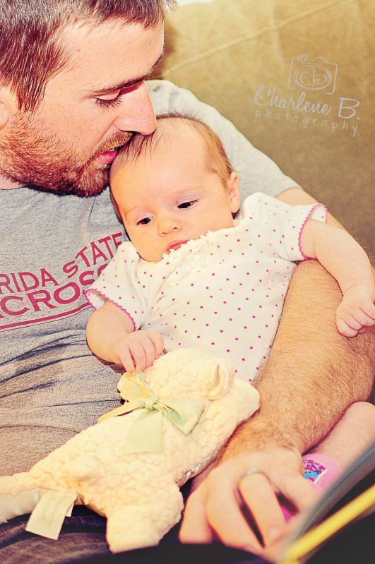 daddy reading to baby photo