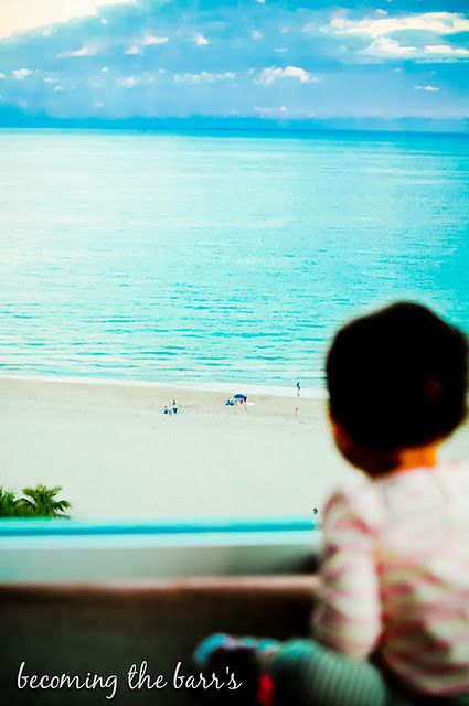 baby looking at the beach