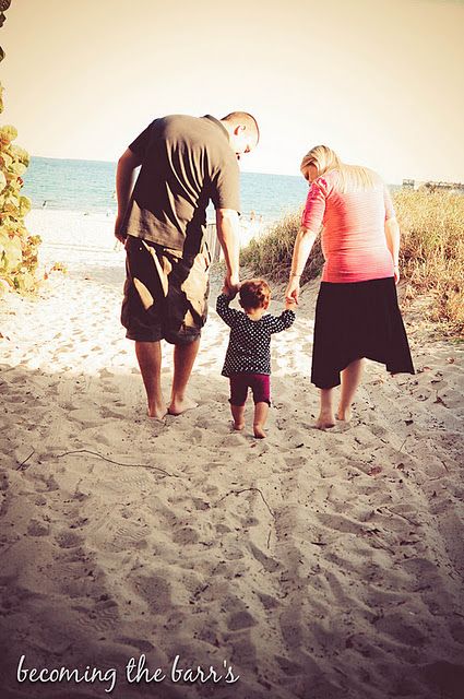 family photos on the beach with baby