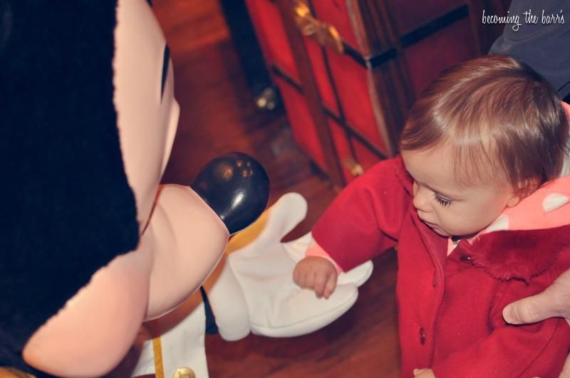 baby meeting mickey mouse for the first time