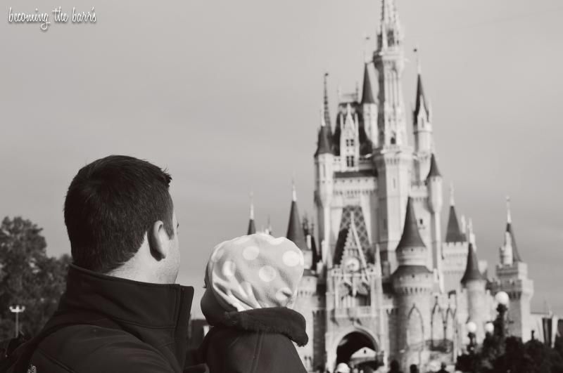 baby and daddy in front of magic kingdom castle