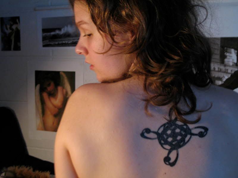 modern Celtic stamp tattoo, girl tattoo, back tattoo