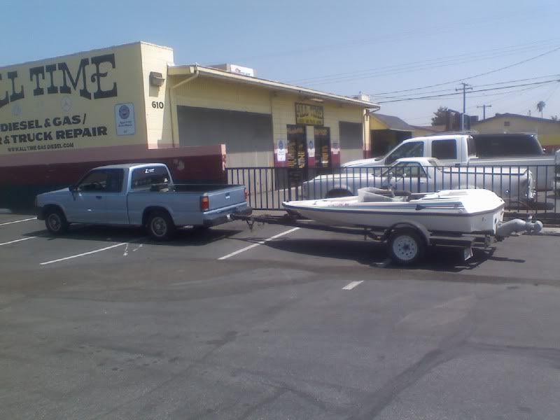 Small 19 year old truck towing an even smaller 20 year old boat.