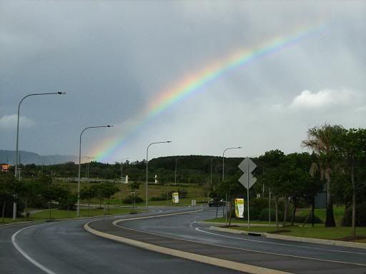 Early morning rainbow at Casuarina Beach -- it gave me something to look at while I fixed a flat
