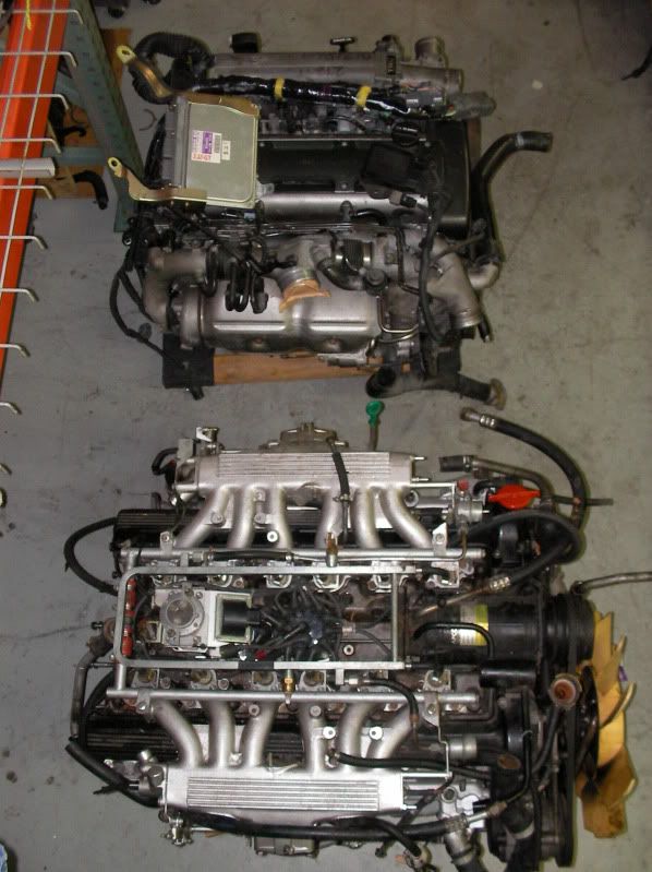 V12 Jaguar engine next to 2JZ engine