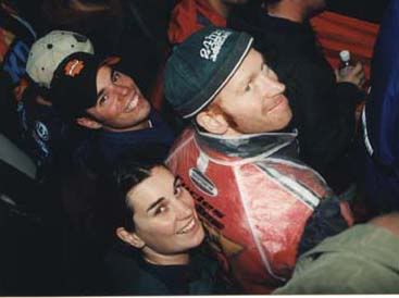 Am I drunk yet? Hanging on Rick Warner's
shoulders while he stands on the beer cooler. Dual at the '98 Worlds