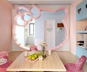 dining room with aparture wall in the shape of a giant Hello Kitty head