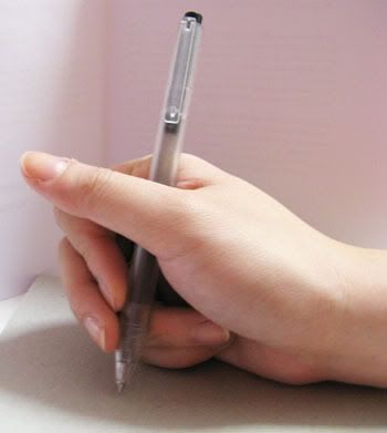 Anyway, here's a picture of how I hold my pen, and you can try to figure out 