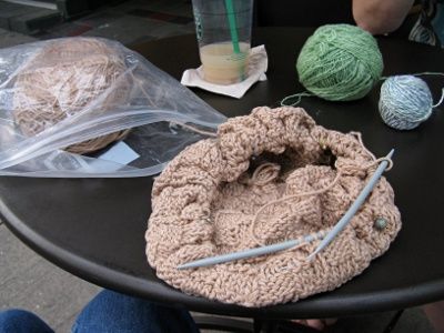 A cotton breadcloth being worked from the center, in the round, in medium tan cotton.