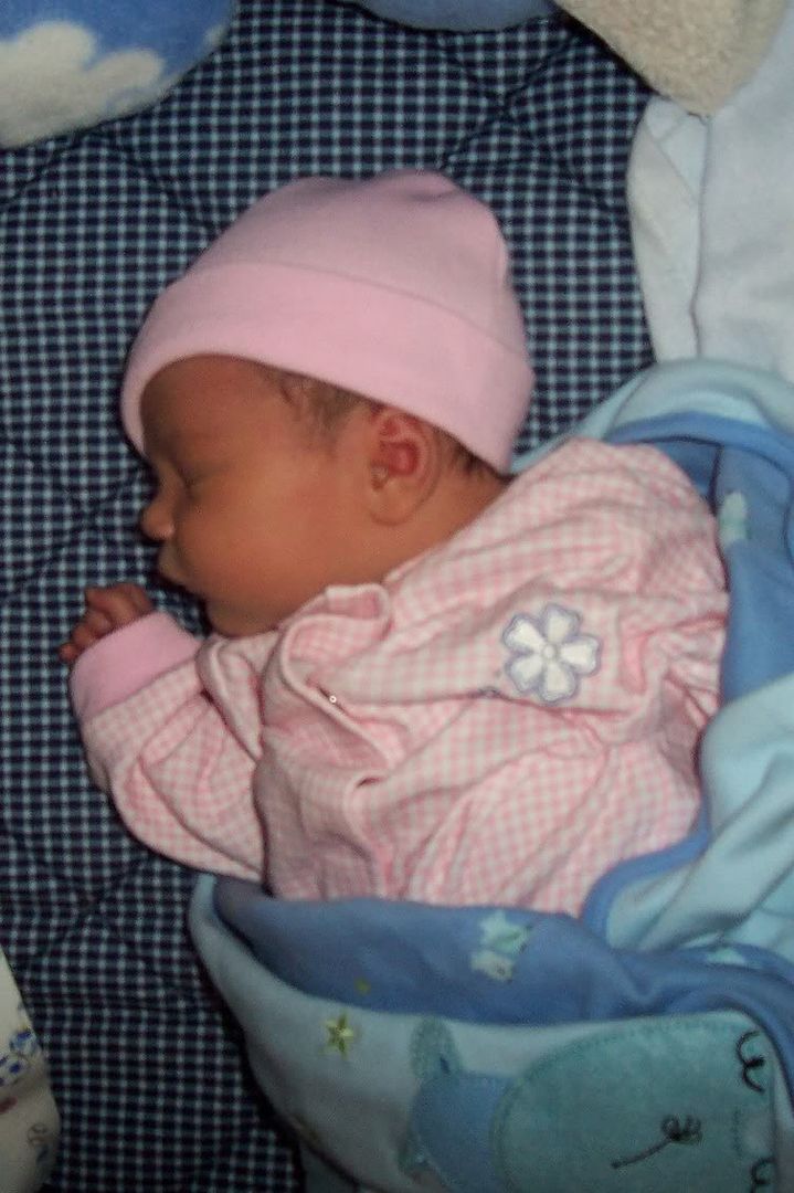 Leah in her new pink sleeper and hat