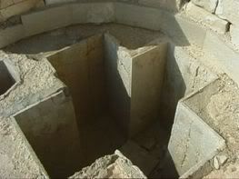 Baptismal font in the form of a cross. Located in Avdat, Israel. This font dates from the 2nd century A.D.