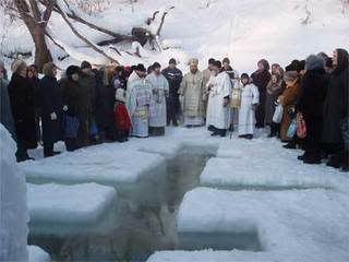 Cutting a hole in the ice for baptism at Ishim, Russia