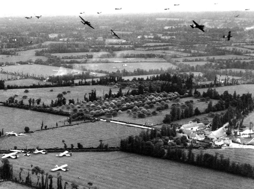 TowplanesandglidersabovetheFrenchcountrysideduringtheNormandyinvasioninJuneof1944atanobjectiveoftheUSArmyNinthAirForce.jpg