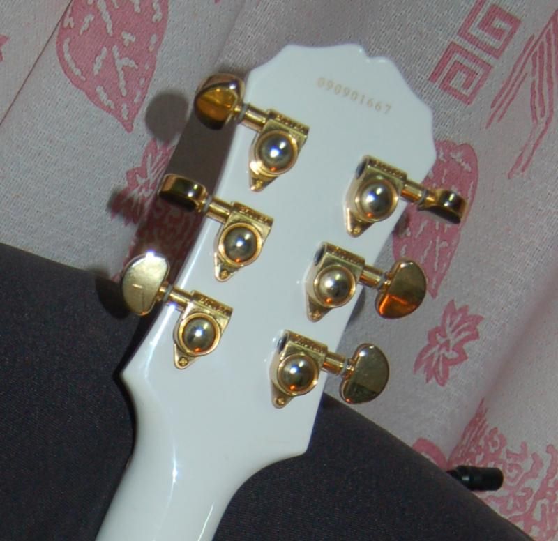 The serial number is 090901667 which Guitar Dater says is a Korean made in September '09 FWIW. Here are the pics, hopefully it helps.