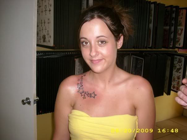  her chest) and touching up her first pelvic tattoo from a few years ago.