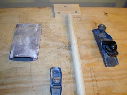 Two small hand planes and a little sheet of sand paper for shaping the rattan.
