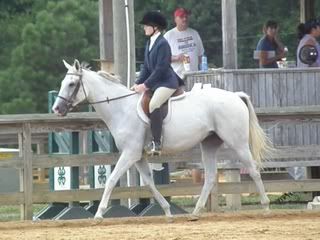 Nina and Mystic trotting in the show ring.