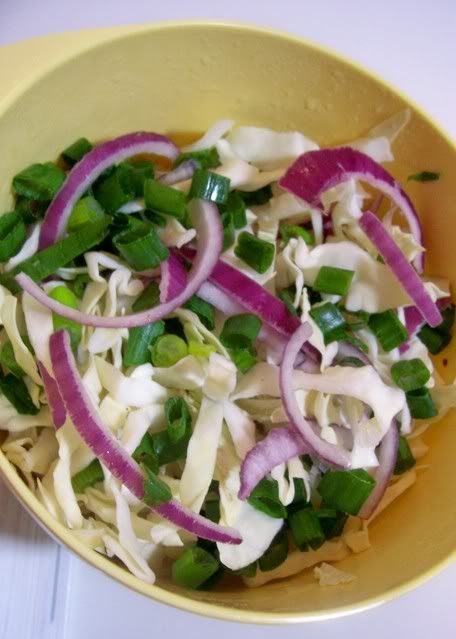 Slaw mix Cabbage, scallions, and red onions just before they are tossed with red wine vinegar and mayonaise and transformed into a fresh, crisp slaw with a bit of a bite.