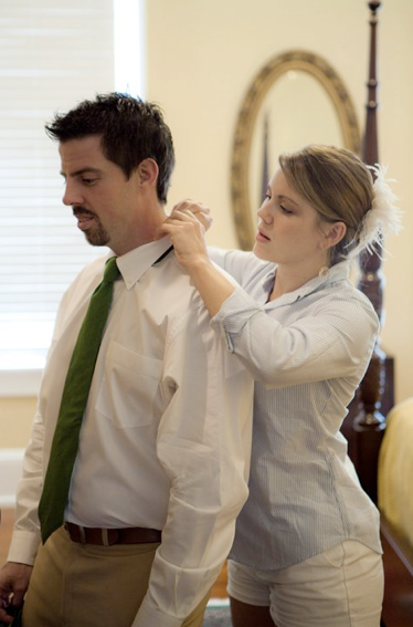 Bride tying tie